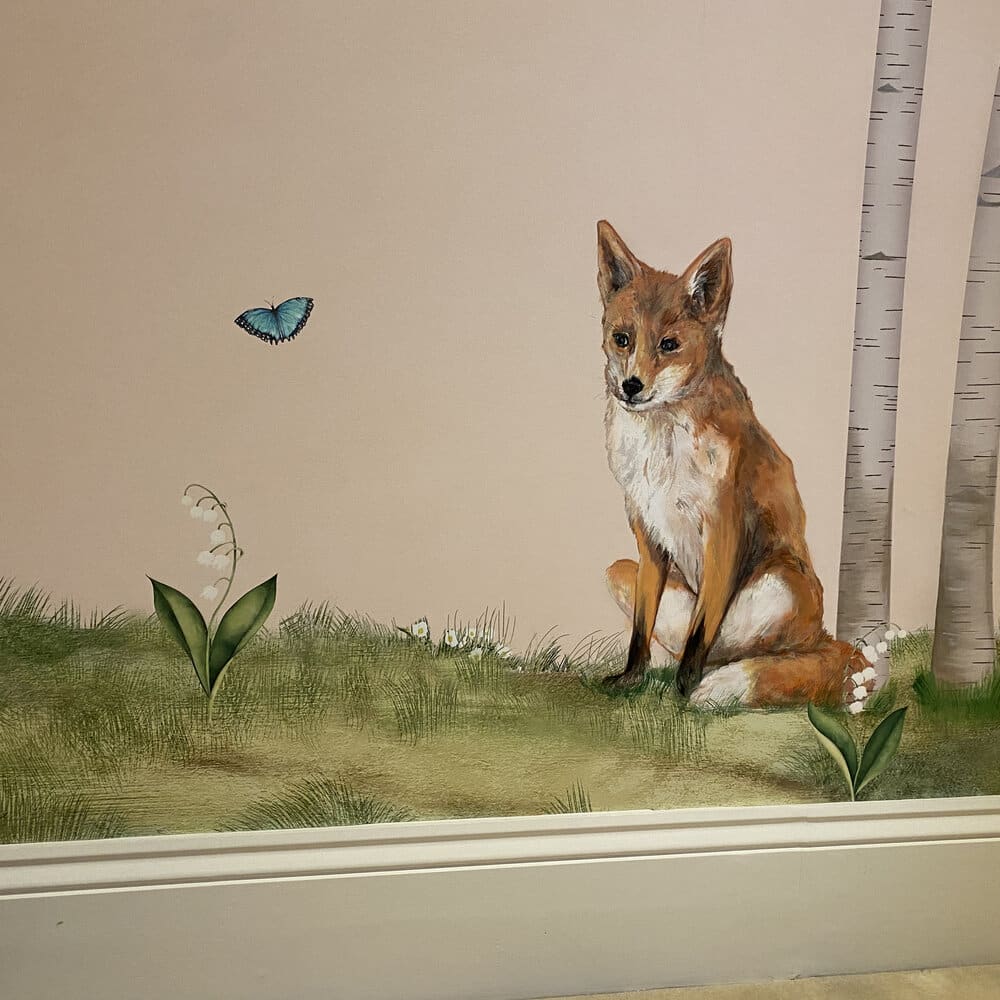 colourful wall mural of a fox sat on grass