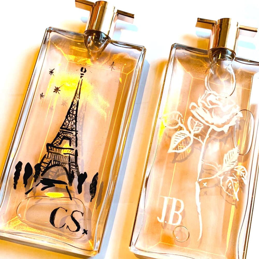 illustrations on 2 glass fragrance bottles