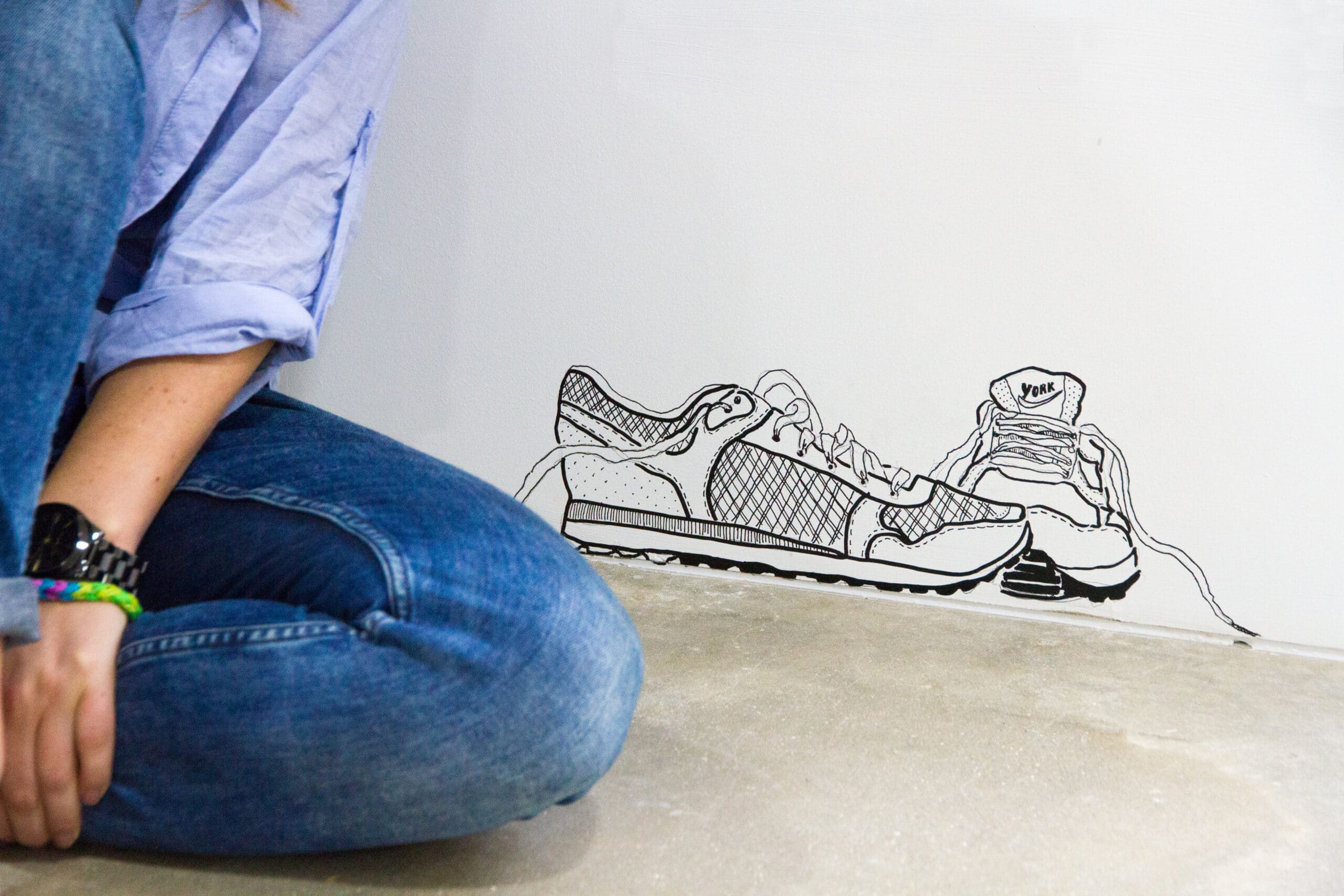 trainers on a wall